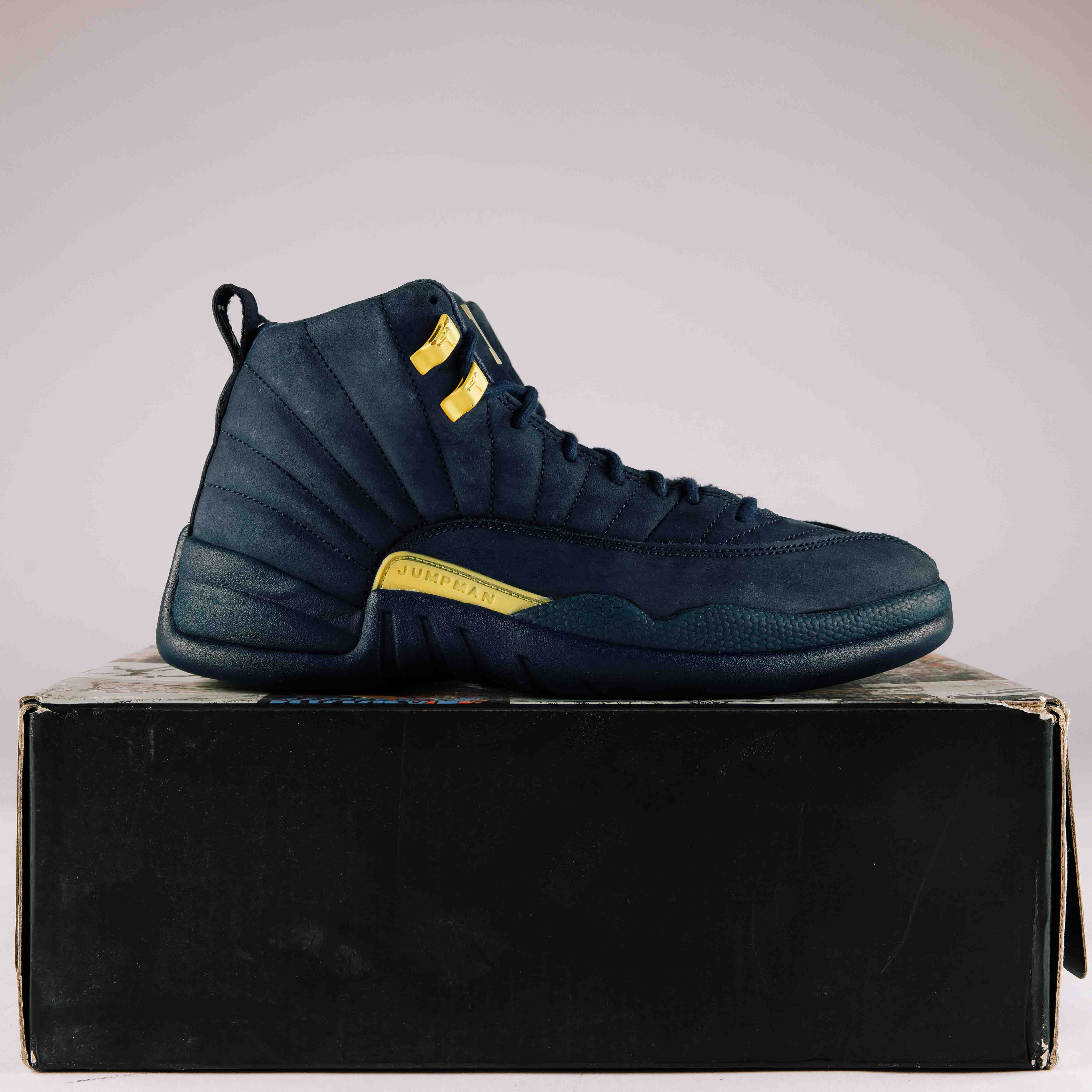 Jordan 12 retro michigan hotsell