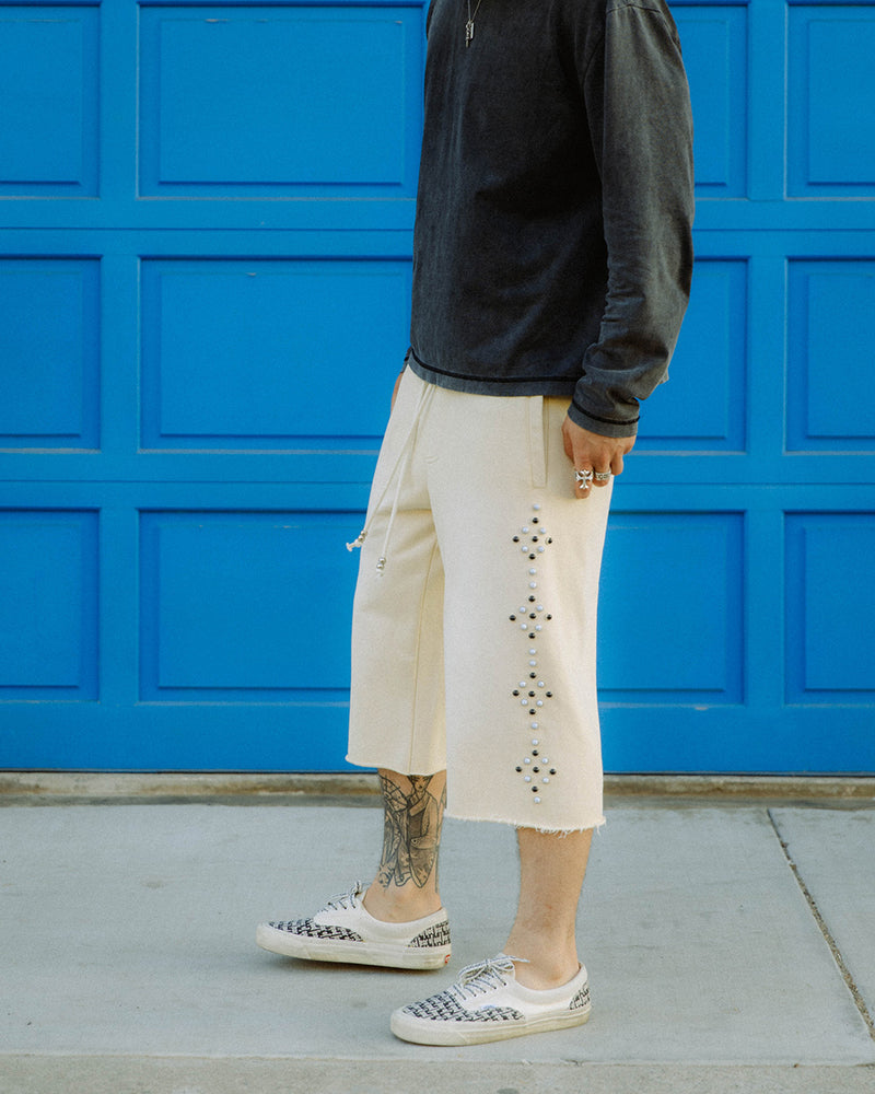 Commons Studios sweatshort in cream with pearl and black stud detailing